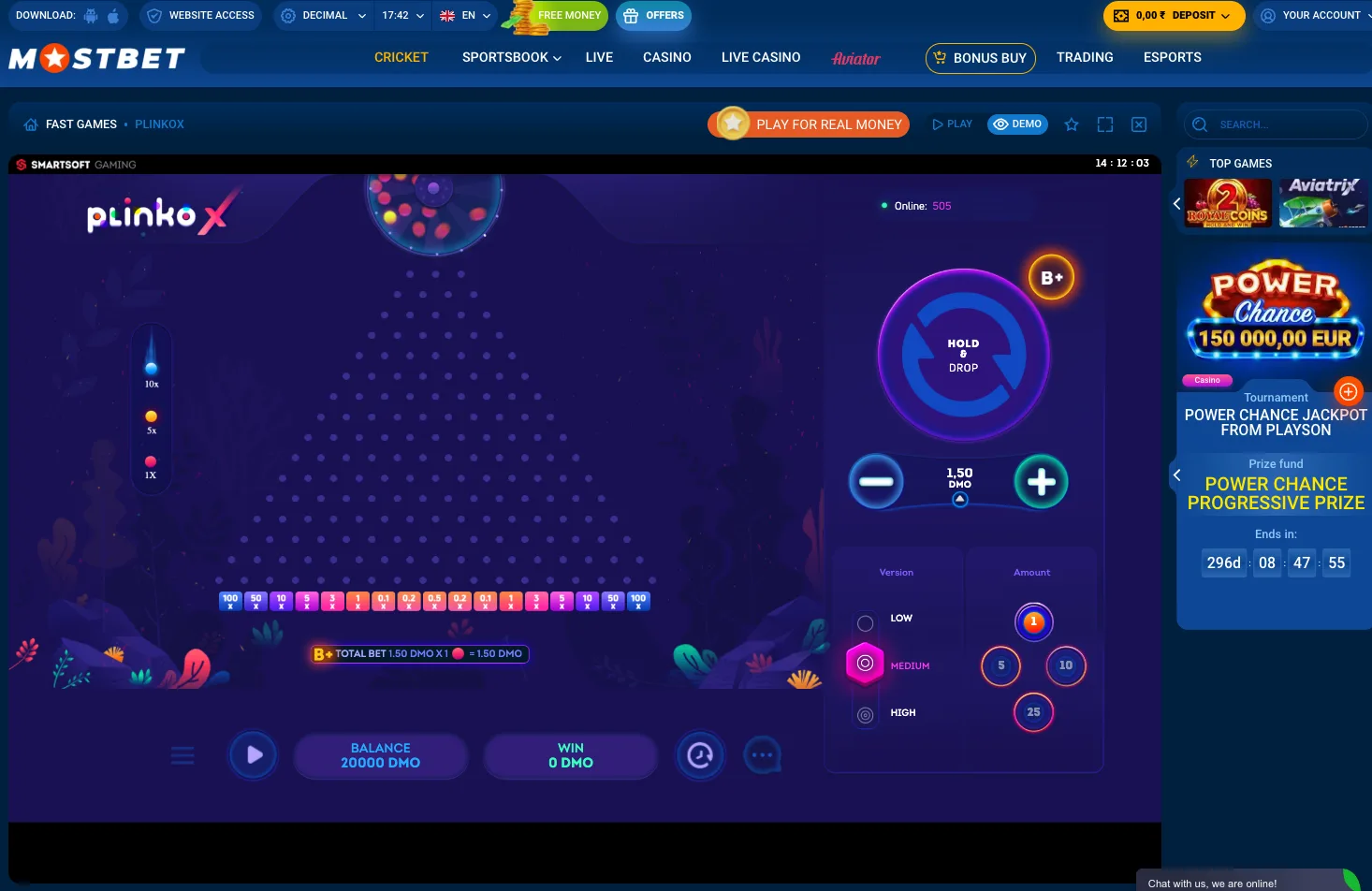 PlinkoX by Smartsoft on Mostbet showing the pegboard, version selector, and hold-and-drop control